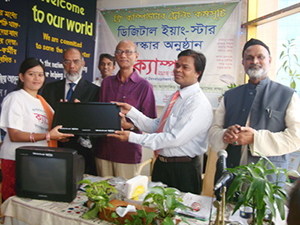 Education Minister Nurul Islam Nahid is handing over Computers to the Awardee of Digital Young Star Award as Chief Guest; Dr. M Helal is presiding over. (2010)